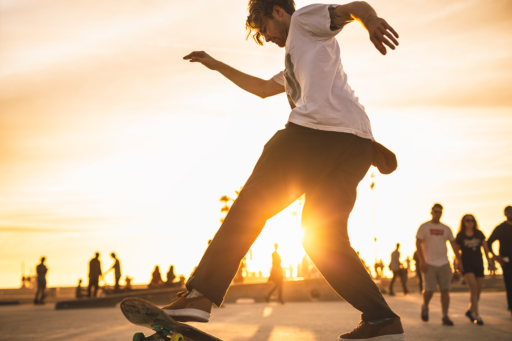 Venice Boardwalk and Skateboarder at Sunset 